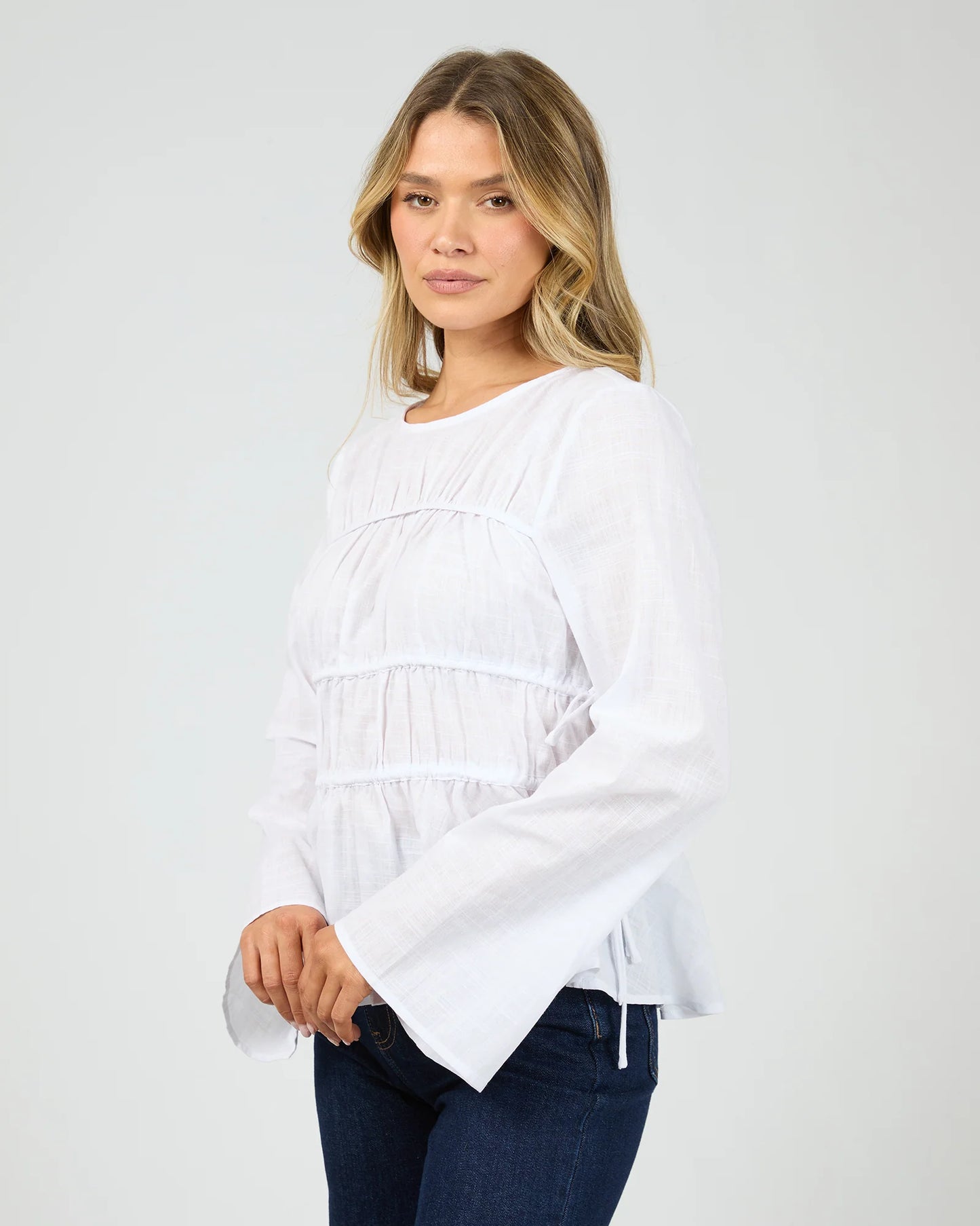 
                  
                    ALL ABOUT LOU LOU TIE LS TOP-White
                  
                