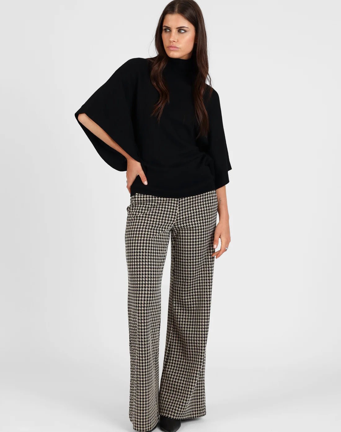 
                  
                    Batwing Roll Neck Merino Sweater
                  
                